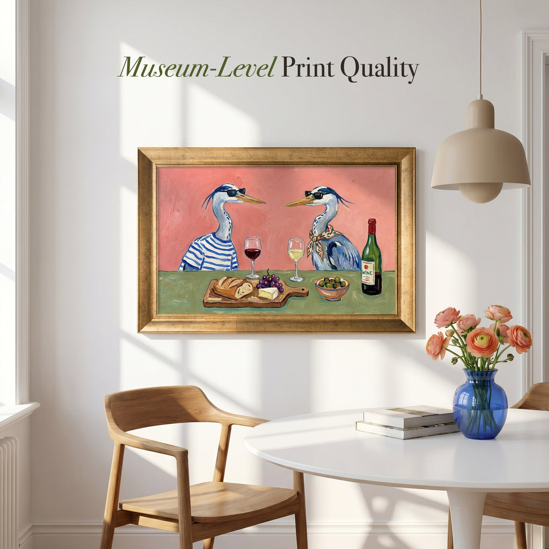 Two herons in sunglasses sharing wine, bread, grapes and cheese at a green table on a pink wall, gold frame